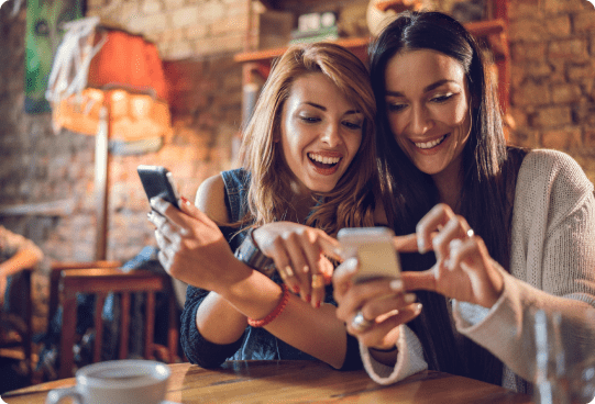 2 ladies on their mobiles